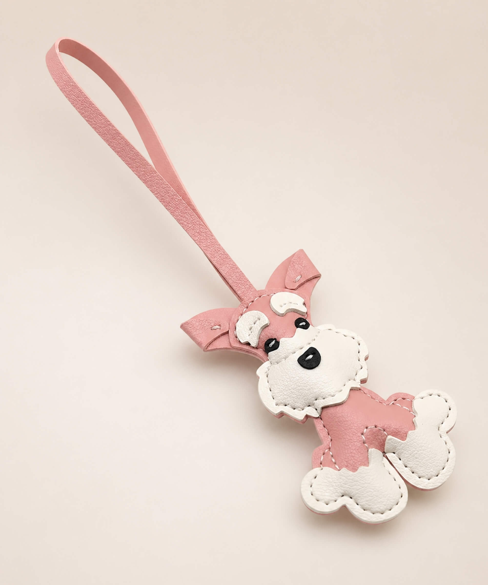 Pink Cute Schnauzer PU leather keychain with white details and wrist strap on a clean studio background.